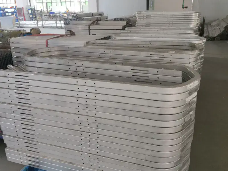 Metal reformer components awaiting machining and assembly in a Pilates equipment workshop