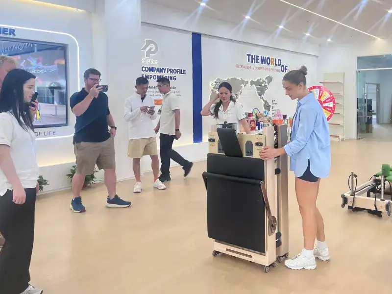 PE Pilates team discussing product details with a buyer