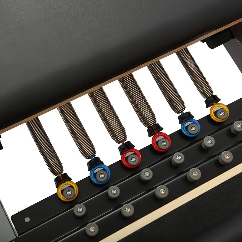 Patented anti-pinch spring system for Pilates reformer