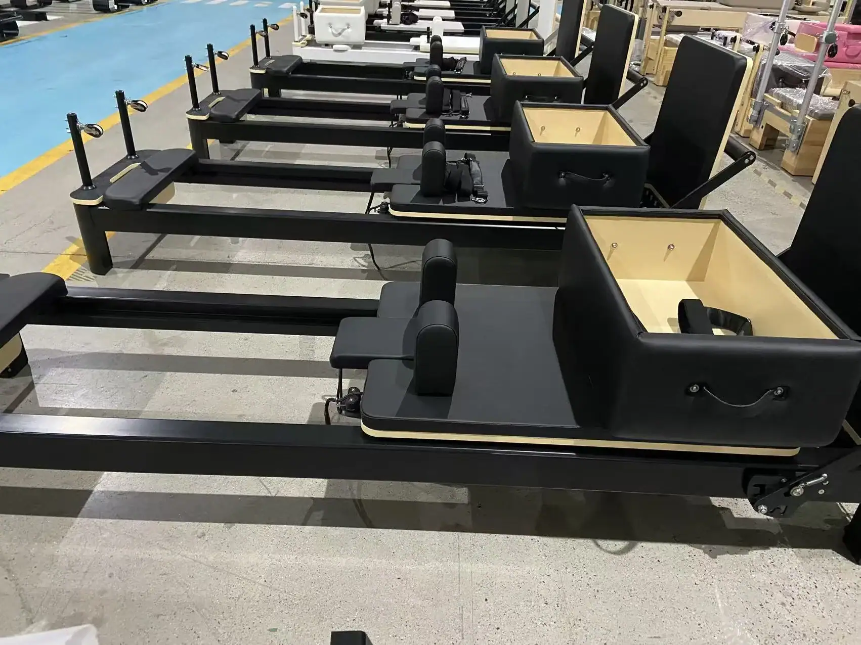 AL4-401 aluminum Pilates reformers arranged for batch inspection