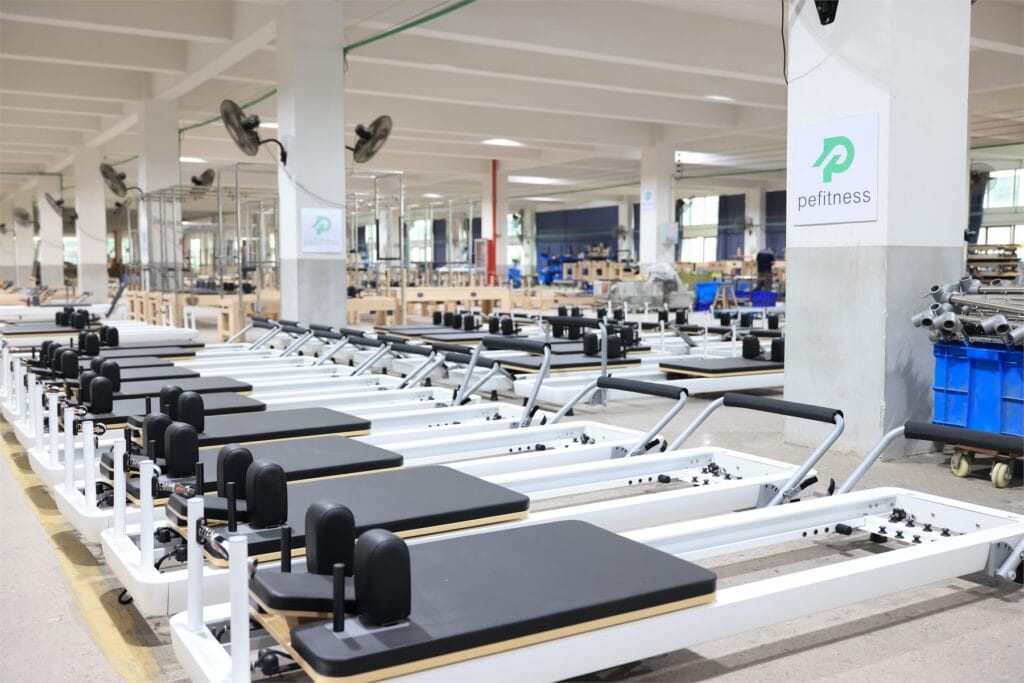 commercial Pilates reformer setup in PE Pilates factory showroom