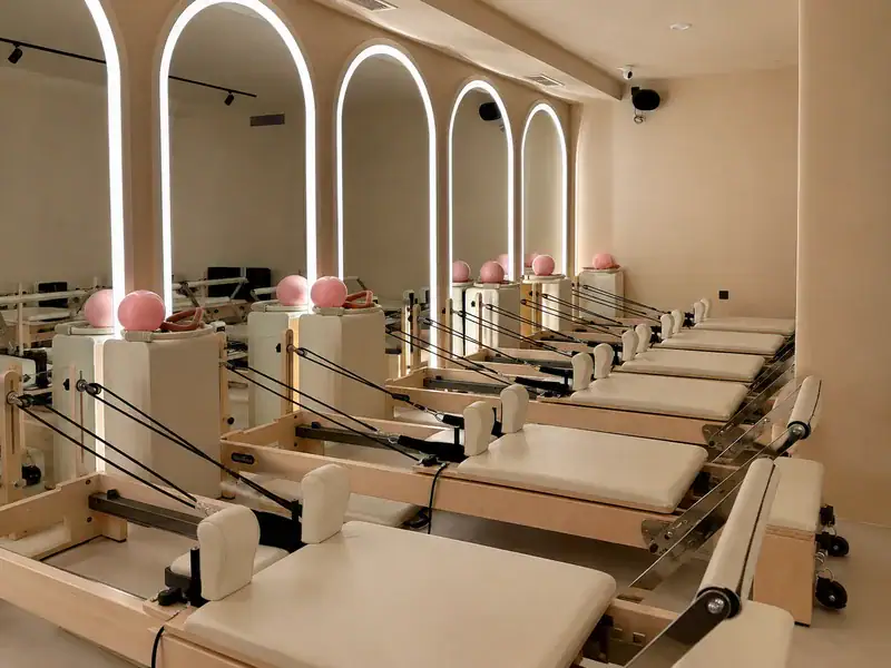 Fixed Pilates reformers in a London professional group-class studio