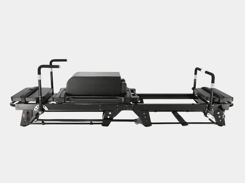 This white aluminum sleek and modern Pilates Reformer features a cushioned carriage, adjustable footbar, and durable resistance cords—perfect for enhancing strength, flexibility, and core stability in any home or studio setting.